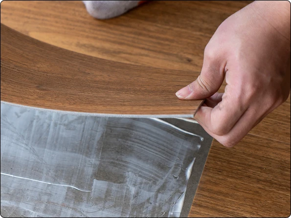 Close-up of luxury vinyl plank flooring core showing stability and feel underfoot